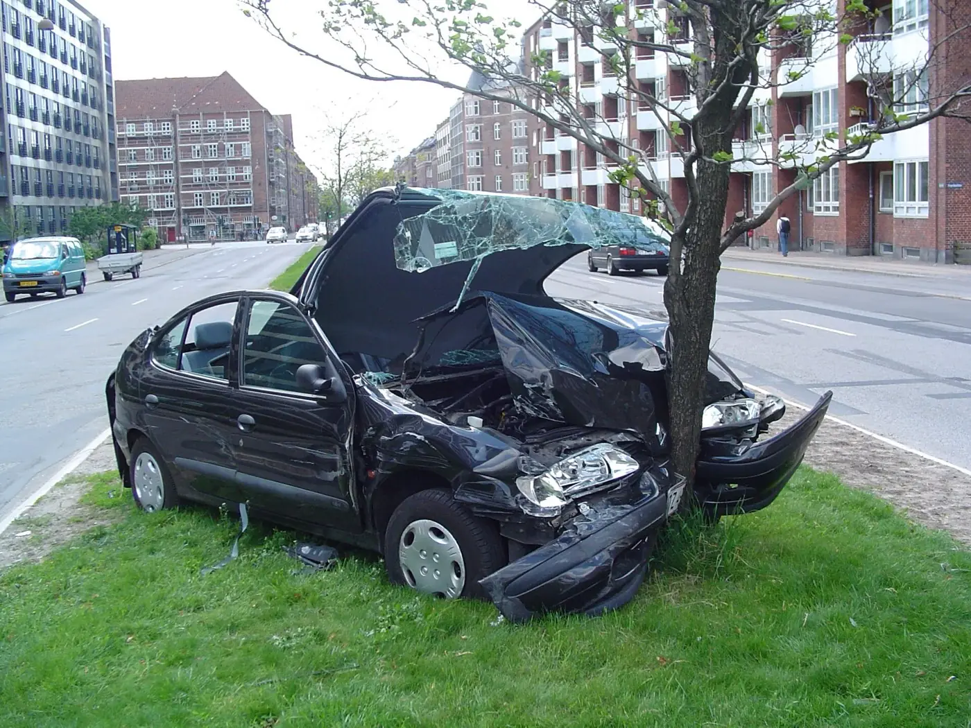 A car with severe front-end damage after a collision
